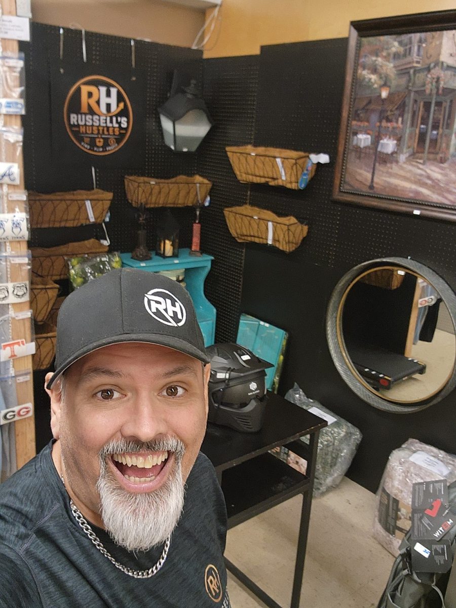 Russell E. Brown in the finished Russell's Hustles booth
