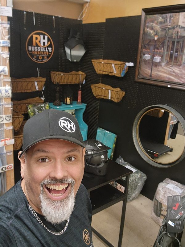 Russell in the finished Russell's Hustles booth